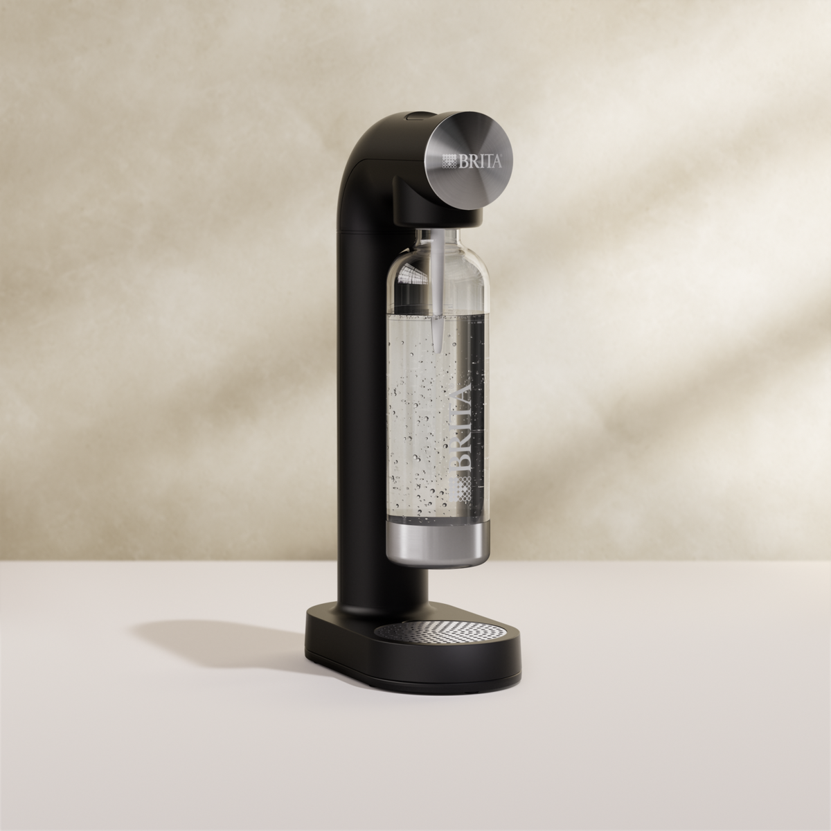 BRITA sodaONE Sparkling Water Maker in black on a beige background